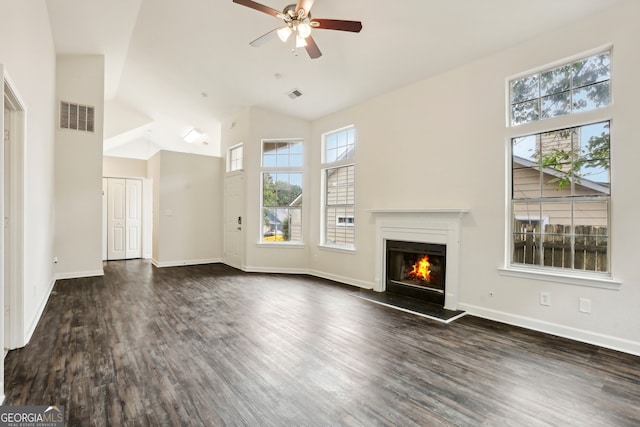 unfurnished living room featuring dark hardwood / wood-style flooring, ceiling fan, and high vaulted ceiling