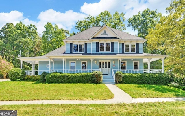 farmhouse inspired home featuring a porch and a front yard