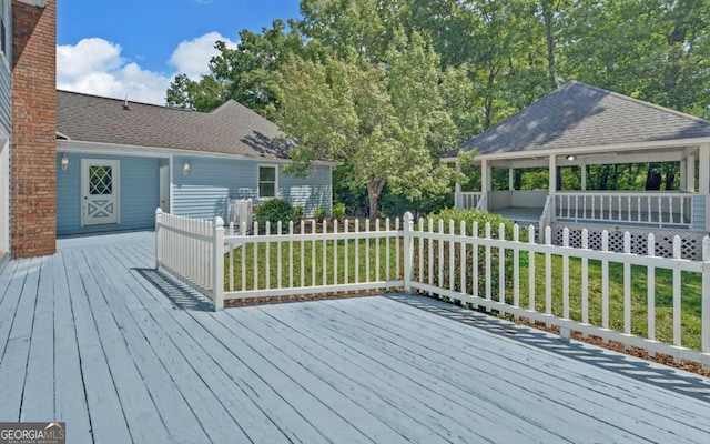 wooden deck with a yard