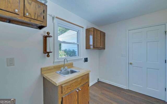 kitchen with dark wood-type flooring and sink