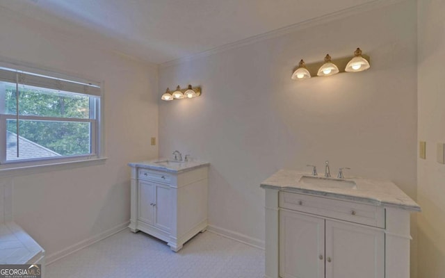 bathroom featuring crown molding and vanity