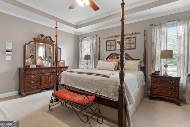 bedroom featuring light carpet, crown molding, and ceiling fan