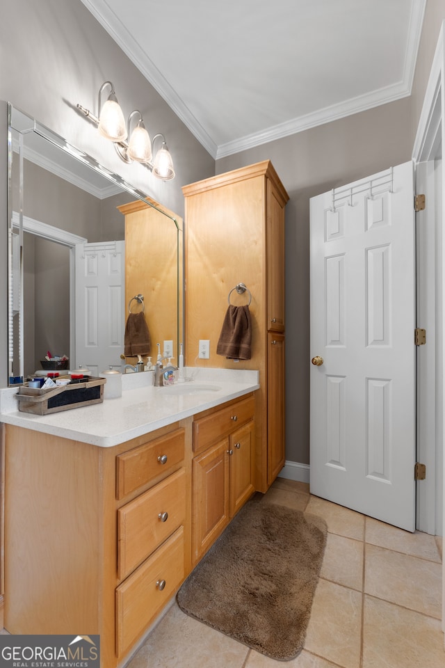 bathroom featuring ornamental molding, vanity, and tile patterned floors