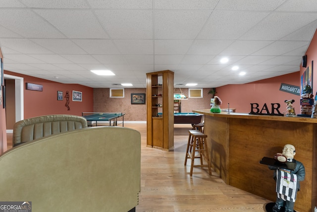 bar featuring a drop ceiling, light hardwood / wood-style floors, and billiards