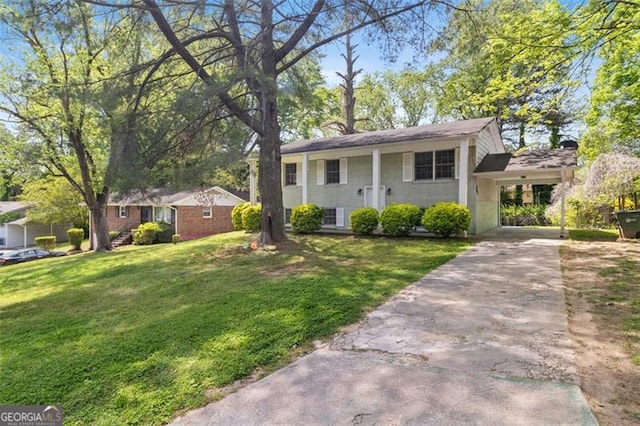 view of front facade with a front lawn and a carport