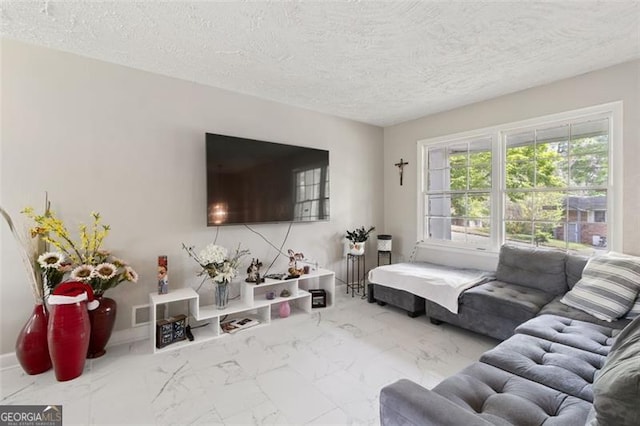 living room with a textured ceiling