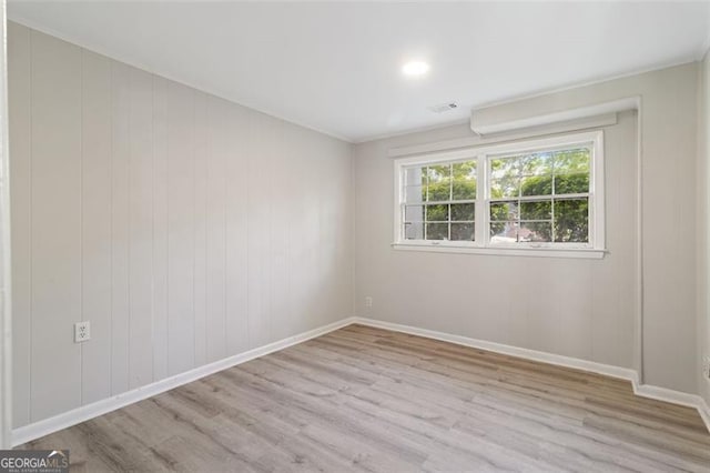 spare room featuring light wood-type flooring