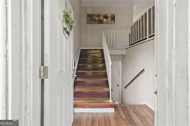 stairway with wood-type flooring