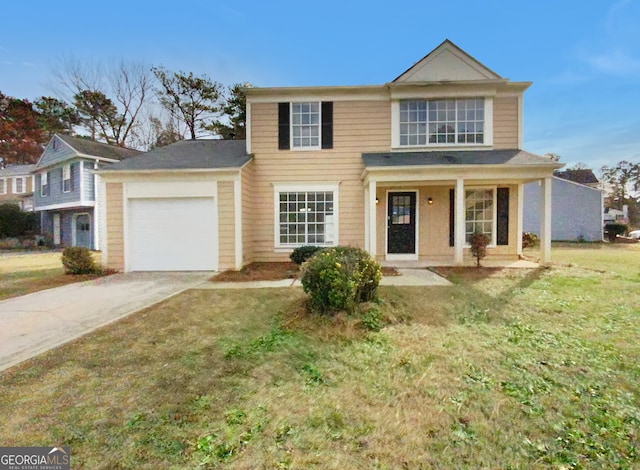 view of front of home featuring a front yard, a garage, and a porch