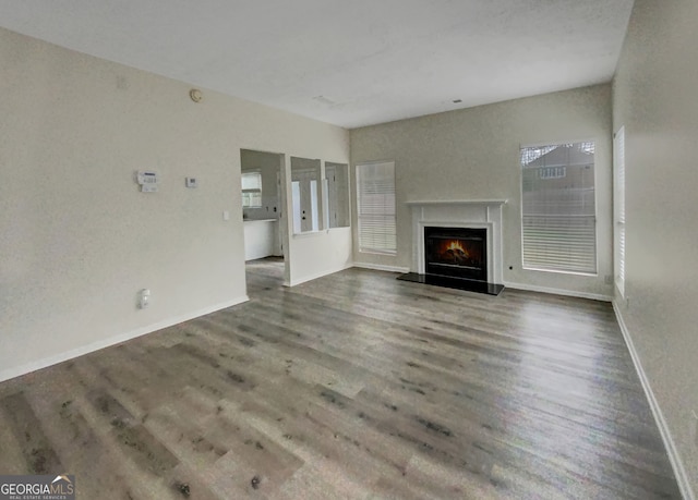 unfurnished living room with hardwood / wood-style floors