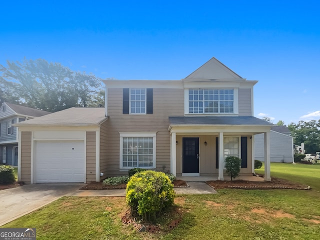 traditional home featuring concrete driveway, a garage, a front lawn, and covered porch