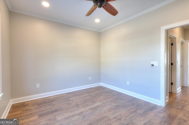 empty room with hardwood / wood-style flooring, ceiling fan, and crown molding