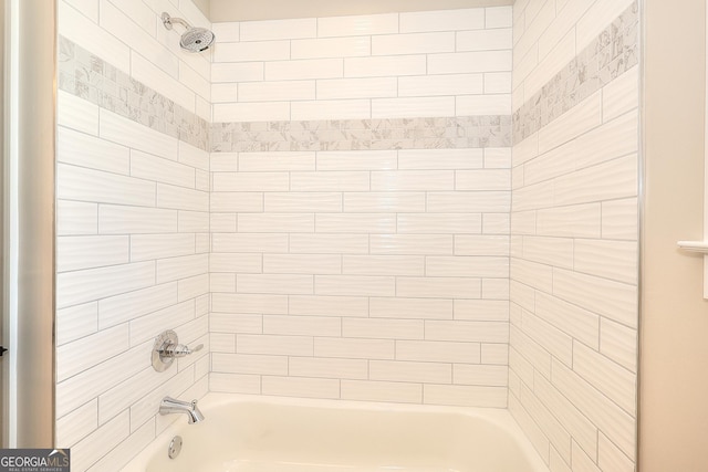 bathroom featuring tiled shower / bath combo