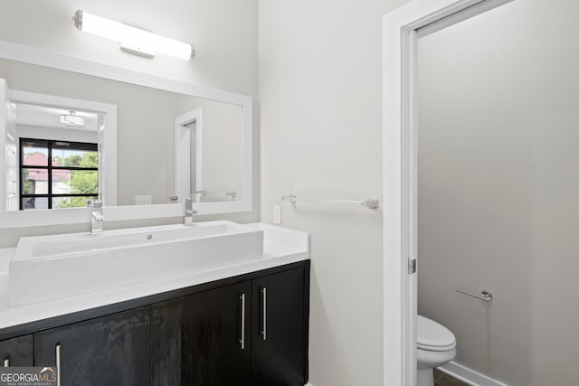 bathroom with vanity and toilet