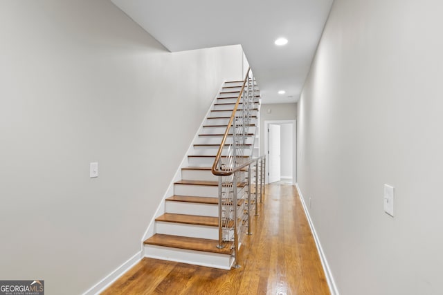 staircase featuring hardwood / wood-style flooring