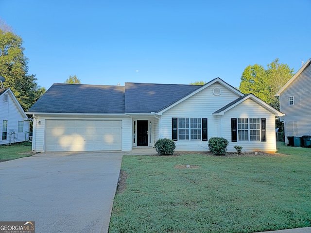 ranch-style home featuring a garage and a front yard