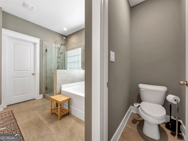 bathroom featuring separate shower and tub, tile patterned flooring, and toilet