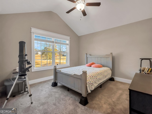 carpeted bedroom featuring vaulted ceiling and ceiling fan