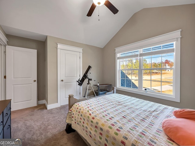 carpeted bedroom featuring vaulted ceiling and ceiling fan