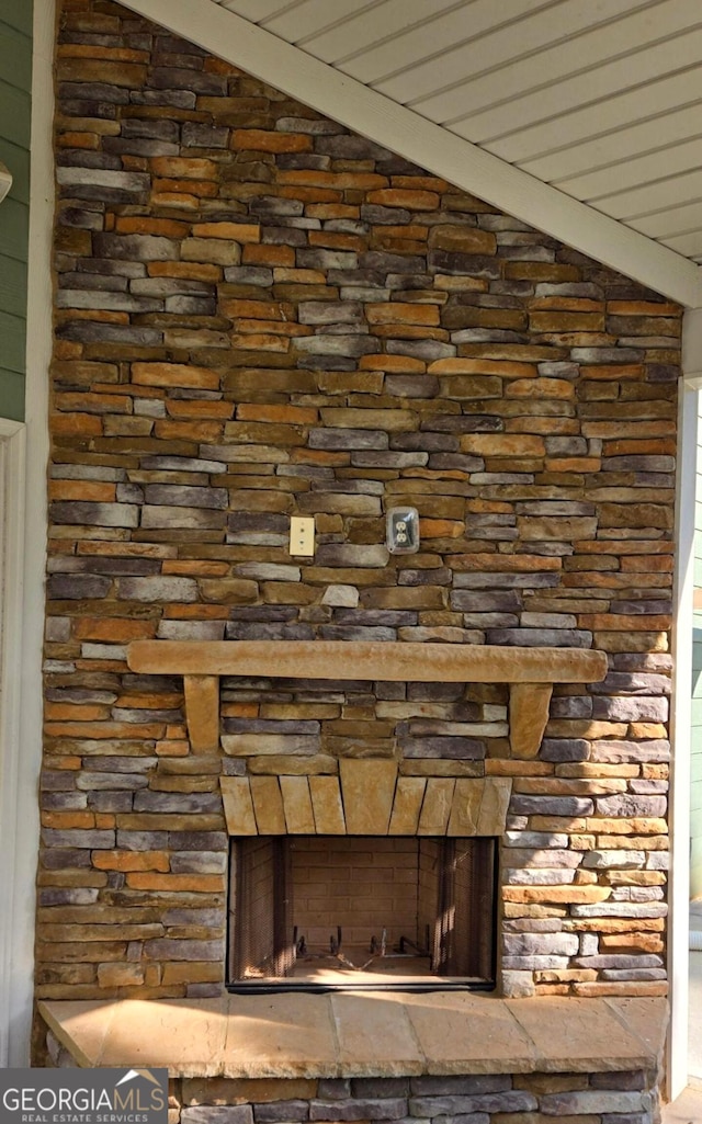 room details with a stone fireplace