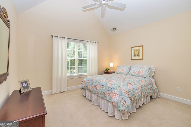 carpeted bedroom featuring ceiling fan and high vaulted ceiling