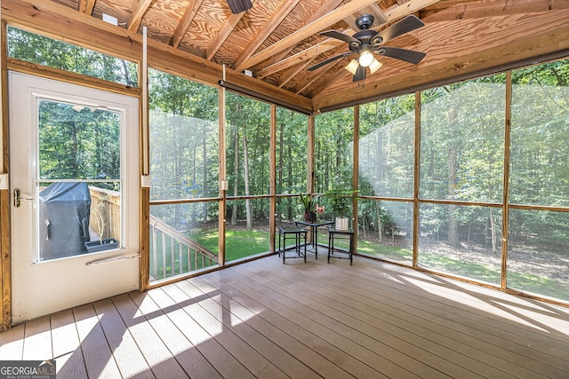 unfurnished sunroom featuring lofted ceiling and ceiling fan