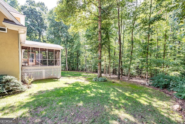 view of yard with a sunroom