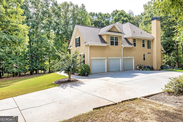 exterior space featuring a front lawn and a garage