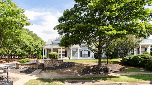 obstructed view of property with covered porch