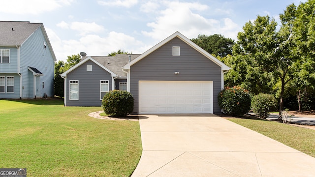 view of front of house featuring a garage and a front lawn