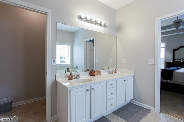 bathroom featuring tile patterned flooring and vanity