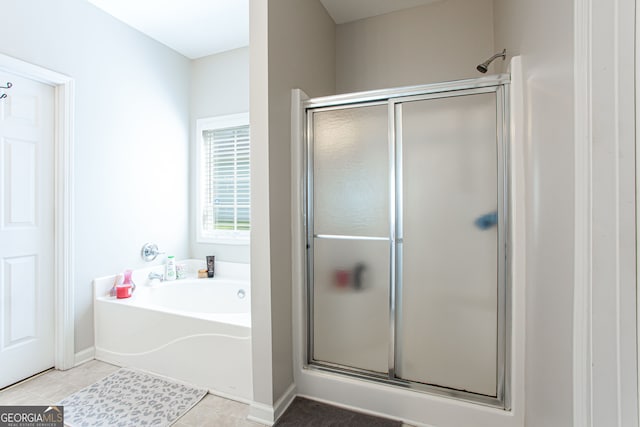 bathroom with tile patterned flooring and plus walk in shower