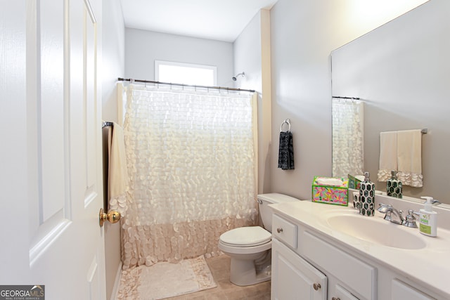 bathroom featuring vanity, toilet, and tile patterned floors