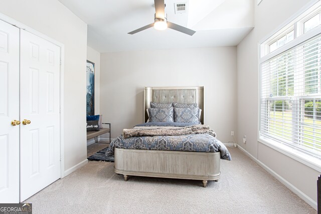 bedroom with ceiling fan and carpet floors