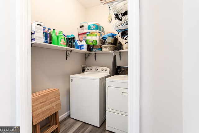 laundry area with wood-type flooring and washer and clothes dryer