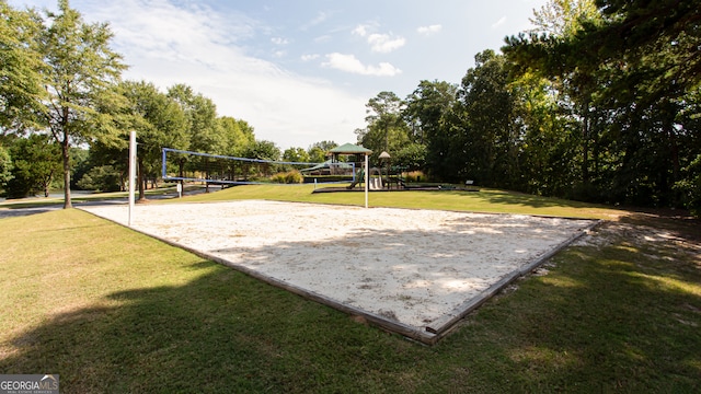 surrounding community with a playground, a yard, and volleyball court