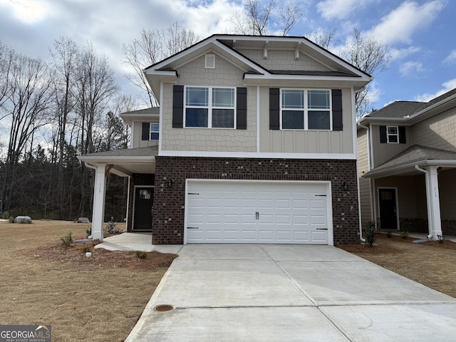 view of front of property with a garage, driveway, and brick siding