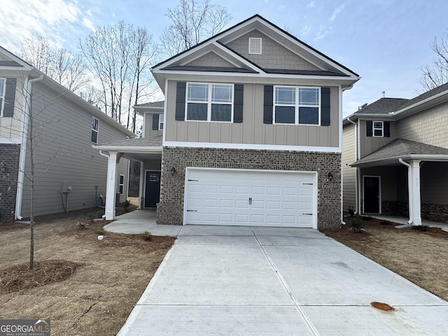 view of front of house with board and batten siding, a garage, and driveway