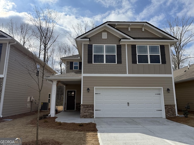 craftsman house with a garage, stone siding, central AC unit, and concrete driveway