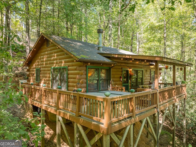 back of house featuring a deck