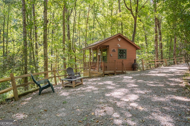 view of side of home featuring a wooden deck