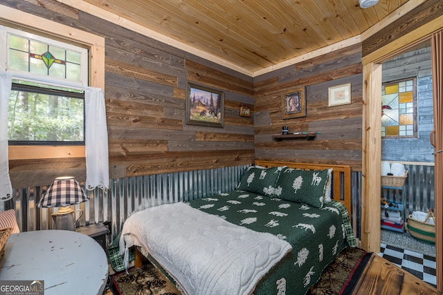 bedroom featuring wood walls and wooden ceiling