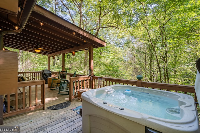 deck featuring area for grilling and a hot tub