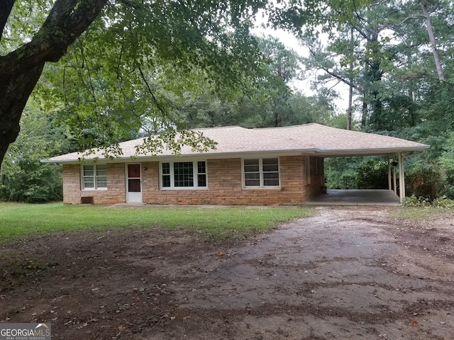 ranch-style house with a carport