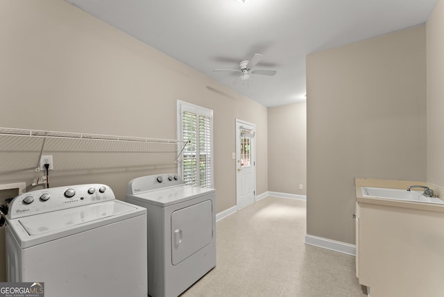 washroom featuring ceiling fan, sink, and washer and dryer