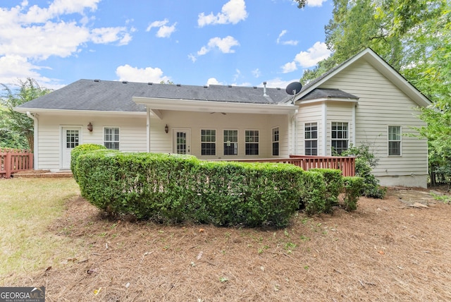 back of property featuring a deck