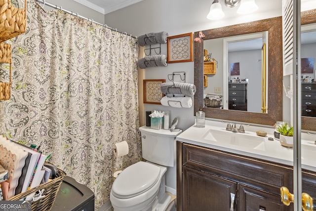 bathroom with vanity, toilet, and crown molding