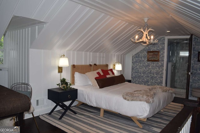 bedroom with vaulted ceiling and an inviting chandelier