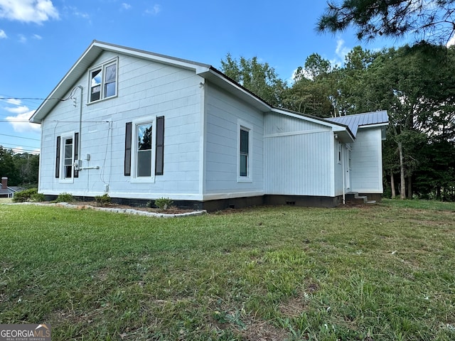 view of home's exterior featuring a lawn