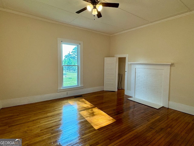 empty room with ornamental molding, dark hardwood / wood-style flooring, and ceiling fan